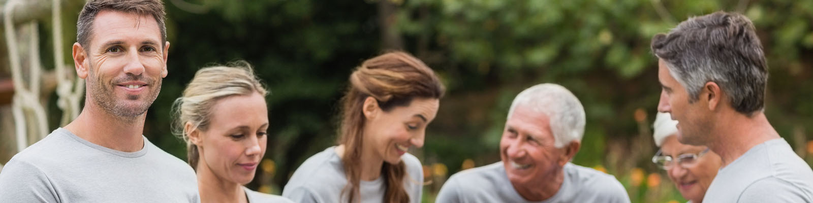 A group of men and women volunteering at a senior living facility